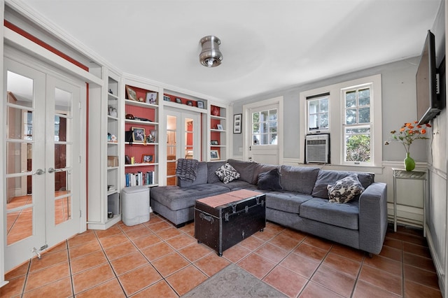 13 Garfield Pl, Poughkeepsie, NY 12601 - living area featuring french doors, built in shelves, light tile patterned floors, and cooling unit