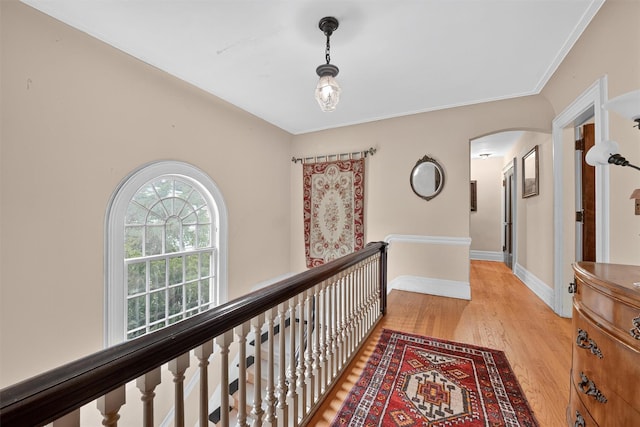 13 Garfield Pl, Poughkeepsie, NY 12601 - hall featuring arched walkways, light wood finished floors, and an upstairs landing
