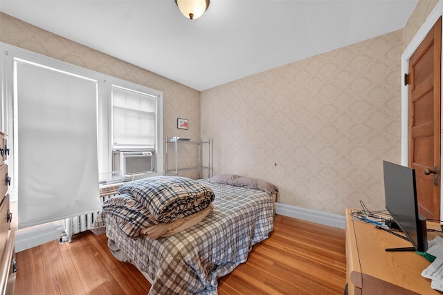 13 Garfield Pl, Poughkeepsie, NY 12601 - bedroom featuring light wood-style floors, wallpapered walls, and cooling unit