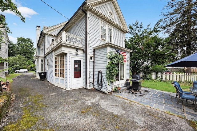 13 Garfield Pl, Poughkeepsie, NY 12601 - rear view of property with a balcony, a patio area, and a chimney