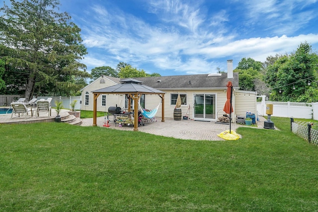 41 Linda St, Port Jefferson Station, NY 11776 - back of property featuring a gazebo, a patio area, a chimney, and a fenced backyard