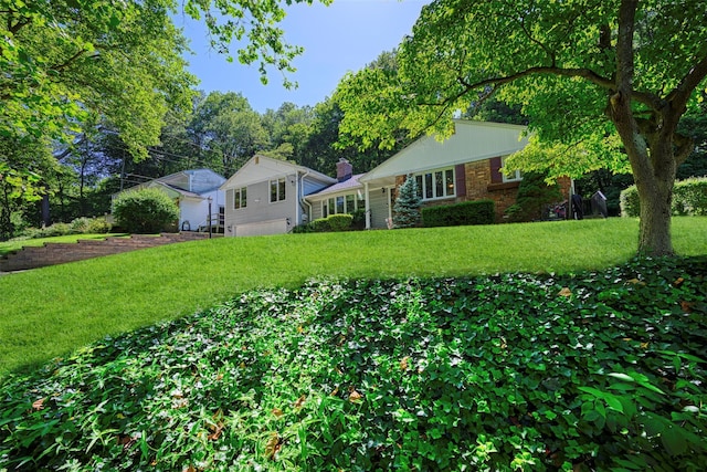 54 Bankside Dr, Centerport, NY 11721 - view of front of house with a front yard, brick siding, and a chimney