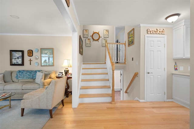 54 Bankside Dr, Centerport, NY 11721 - stairway featuring wood finished floors and ornamental molding