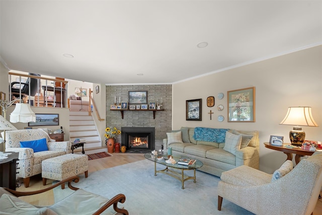 54 Bankside Dr, Centerport, NY 11721 - living area with a brick fireplace, ornamental molding, wood finished floors, and stairs