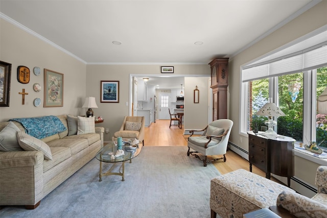 54 Bankside Dr, Centerport, NY 11721 - living room featuring a baseboard heating unit, crown molding, and light wood-style flooring