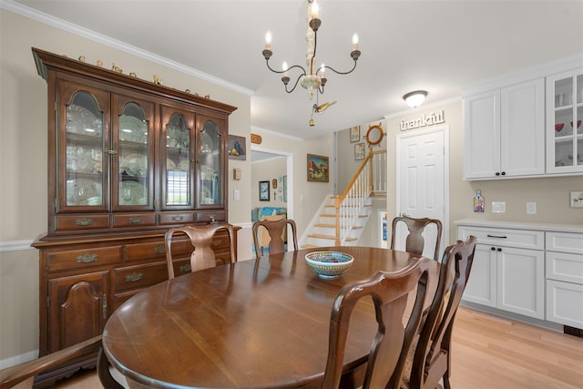 54 Bankside Dr, Centerport, NY 11721 - dining space featuring stairs, a chandelier, light wood-style floors, and crown molding