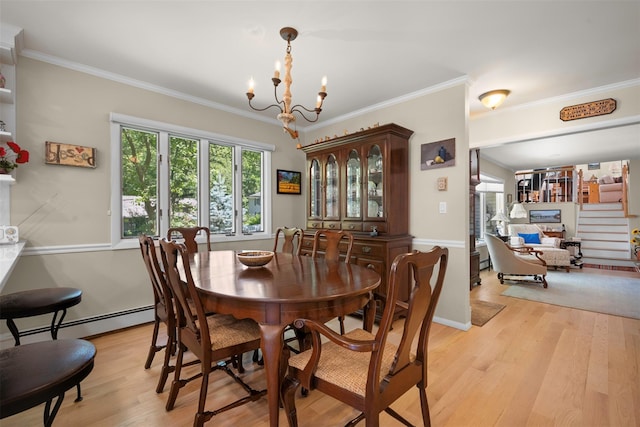 54 Bankside Dr, Centerport, NY 11721 - dining room featuring a baseboard radiator, light wood-type flooring, a chandelier, and ornamental molding