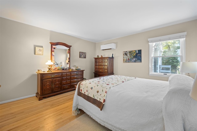 54 Bankside Dr, Centerport, NY 11721 - bedroom featuring a wall mounted AC and light wood-style flooring