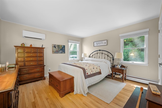54 Bankside Dr, Centerport, NY 11721 - bedroom featuring an AC wall unit, light wood-style floors, and a baseboard heating unit