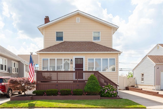 66 Parma Rd, Island Park, NY 11558 - american foursquare style home with a chimney and a shingled roof