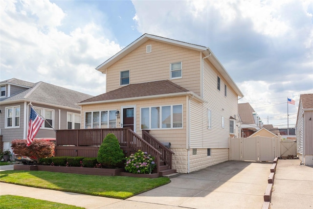 66 Parma Rd, Island Park, NY 11558 - view of front of home featuring driveway, a gate, and a deck