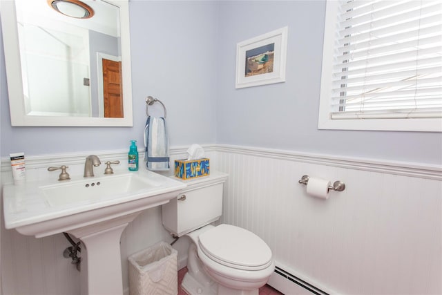 66 Parma Rd, Island Park, NY 11558 - half bath with a wainscoted wall and a baseboard heating unit