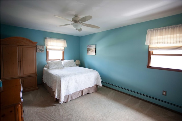 66 Parma Rd, Island Park, NY 11558 - bedroom with a baseboard radiator, carpet, and ceiling fan