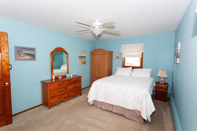 66 Parma Rd, Island Park, NY 11558 - bedroom with light carpet, baseboard heating, and ceiling fan