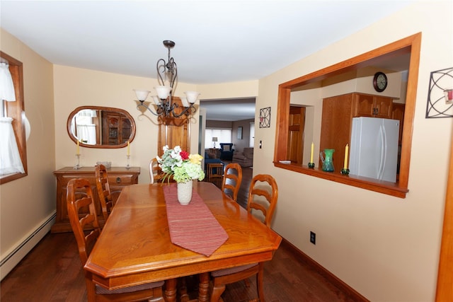66 Parma Rd, Island Park, NY 11558 - dining space featuring baseboard heating, a chandelier, and dark wood finished floors