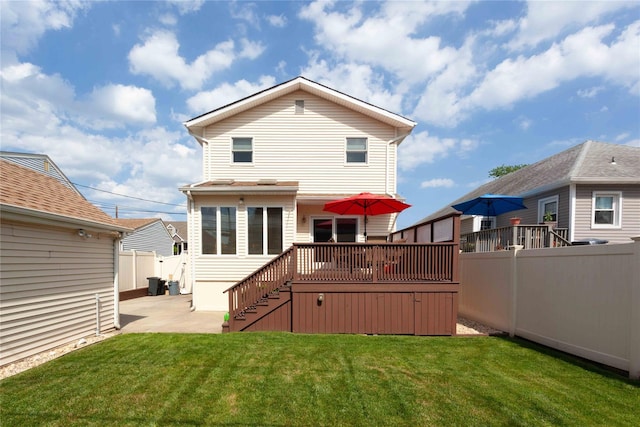 66 Parma Rd, Island Park, NY 11558 - rear view of house with a fenced backyard, a patio, stairway, and a wooden deck