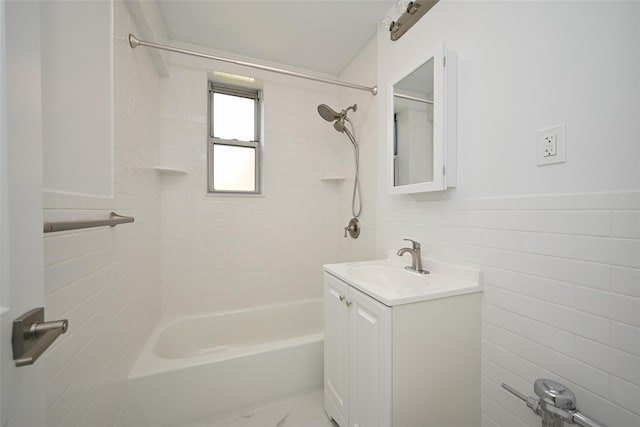 26-21 Union St Unit 1B, Flushing, NY 11354 - bathroom with tile walls, vanity, tub / shower combination, and wainscoting