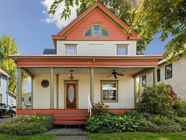 135 Washington Ave, Saugerties, NY 12477 - victorian house with covered porch and a ceiling fan