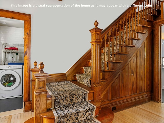 135 Washington Ave, Saugerties, NY 12477 - stairs featuring washer / clothes dryer and wood finished floors