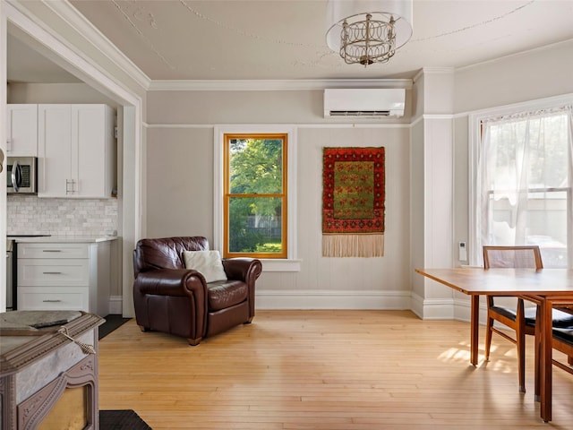 135 Washington Ave, Saugerties, NY 12477 - dining area featuring an AC wall unit, light wood-style floors, and ornamental molding