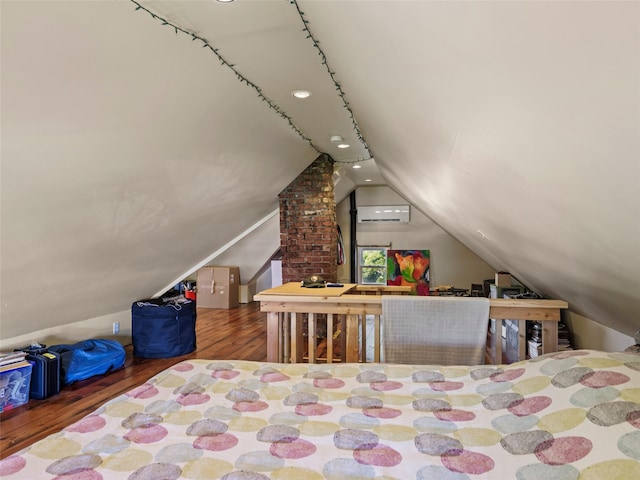 135 Washington Ave, Saugerties, NY 12477 - bedroom featuring lofted ceiling, wood finished floors, and a wall mounted AC