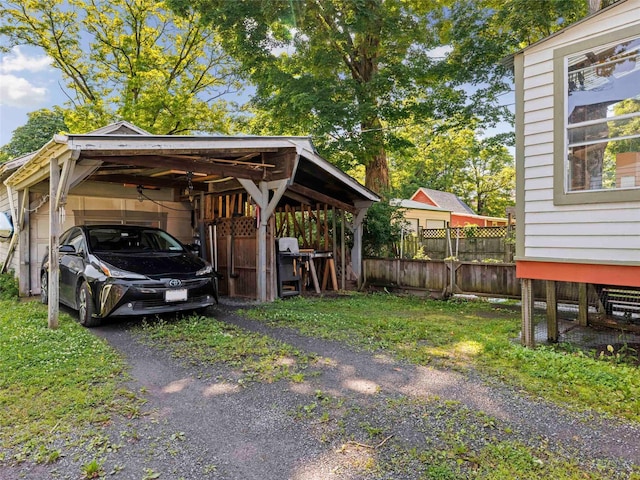 135 Washington Ave, Saugerties, NY 12477 - view of parking with a carport
