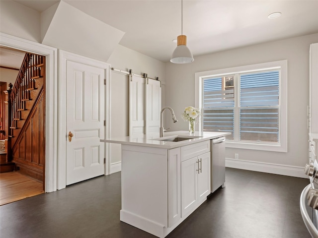 135 Washington Ave, Saugerties, NY 12477 - kitchen with dishwasher, decorative light fixtures, white cabinets, a barn door, and a center island with sink