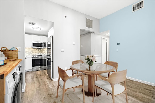 55 Mckinley Ave Unit D3-14, White Plains, NY 10606 - dining space featuring washer / dryer and light wood-style floors