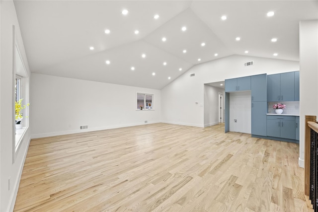 226-07 76th Rd, Bayside, NY 11364 - unfurnished living room featuring light wood-type flooring, recessed lighting, and high vaulted ceiling