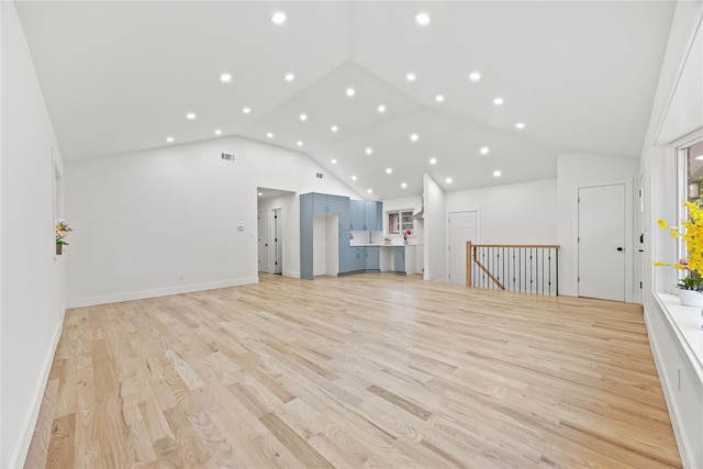 226-07 76th Rd, Bayside, NY 11364 - unfurnished living room with recessed lighting, light wood-style floors, and high vaulted ceiling