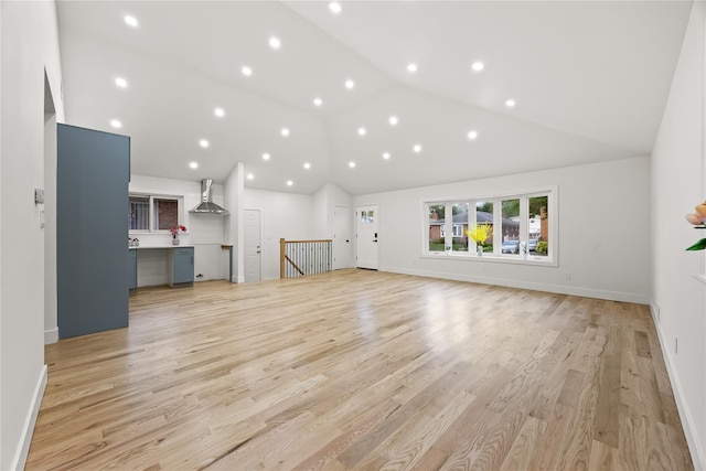 226-07 76th Rd, Bayside, NY 11364 - unfurnished living room with light wood finished floors, high vaulted ceiling, and recessed lighting