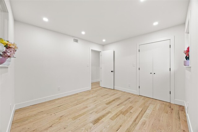 226-07 76th Rd, Bayside, NY 11364 - unfurnished bedroom featuring light wood finished floors and recessed lighting