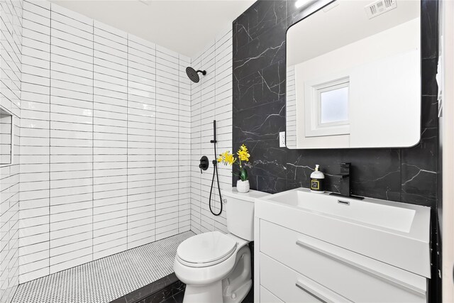 226-07 76th Rd, Bayside, NY 11364 - bathroom featuring vanity, tiled shower, and decorative backsplash