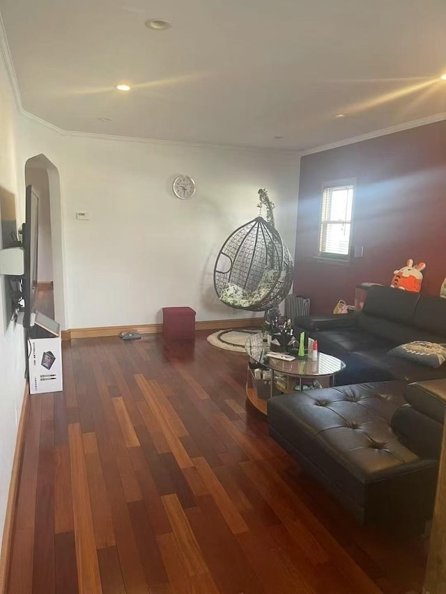 173-02 Effington Ave, Flushing, NY 11358 - living room with arched walkways, crown molding, wood finished floors, and radiator
