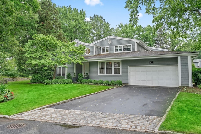 63 Sutton Pl, Manhasset, NY 11030 - traditional home featuring asphalt driveway, an attached garage, a front lawn, and a shingled roof