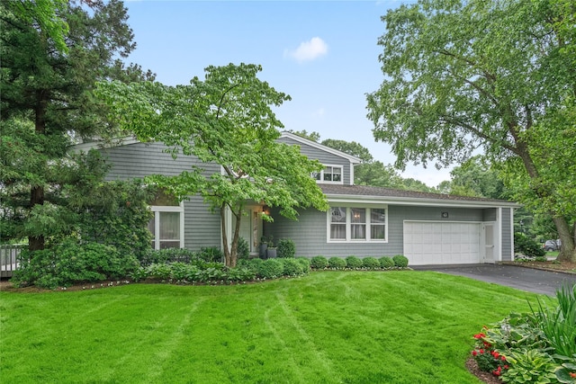 63 Sutton Pl, Manhasset, NY 11030 - view of front of house with asphalt driveway, an attached garage, and a front yard