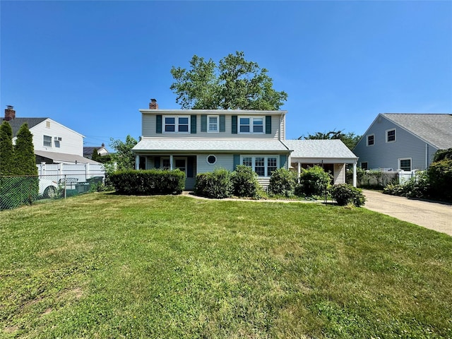 23 Chase Ln, Levittown, NY 11756 - traditional-style house with a chimney