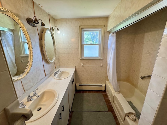 23 Chase Ln, Levittown, NY 11756 - bathroom with a baseboard radiator, tile walls, shower / bath combination with curtain, tile patterned flooring, and double vanity