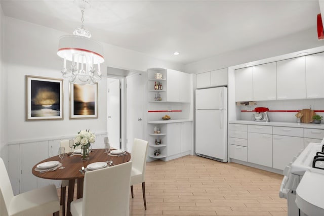 153 Waverly Rd, Scarsdale, NY 10583 - dining space featuring light wood finished floors, a chandelier, and recessed lighting