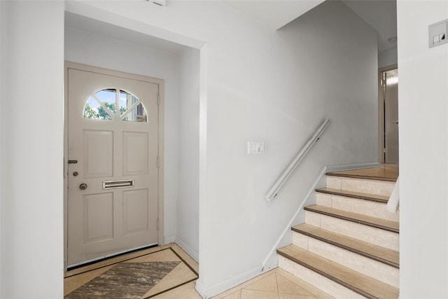 153 Waverly Rd, Scarsdale, NY 10583 - tiled entrance foyer with inlaid floor details and stairway