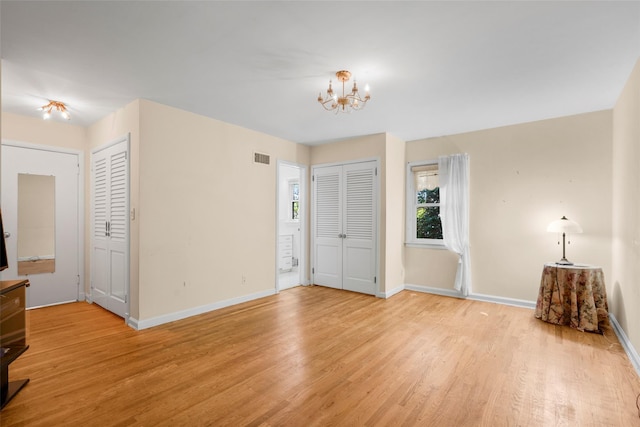 153 Waverly Rd, Scarsdale, NY 10583 - foyer entrance featuring light wood finished floors and a chandelier