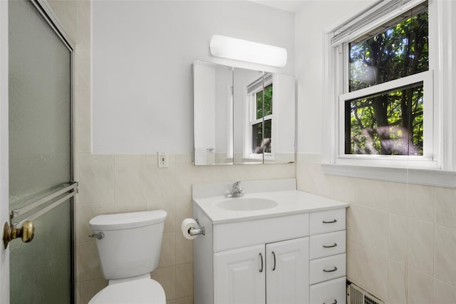 153 Waverly Rd, Scarsdale, NY 10583 - full bathroom with tile walls, vanity, a shower with shower door, and wainscoting