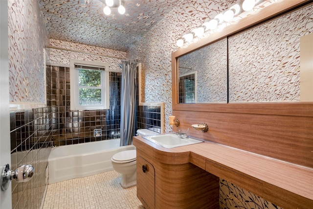 153 Waverly Rd, Scarsdale, NY 10583 - bathroom with vanity, tile patterned floors, shower / tub combo with curtain, and tile walls