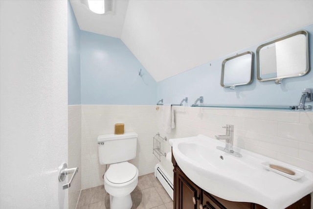 2 Fountain Ln Unit 3P, Scarsdale, NY 10583 - half bathroom featuring a baseboard radiator, vanity, tile walls, a wainscoted wall, and tile patterned flooring