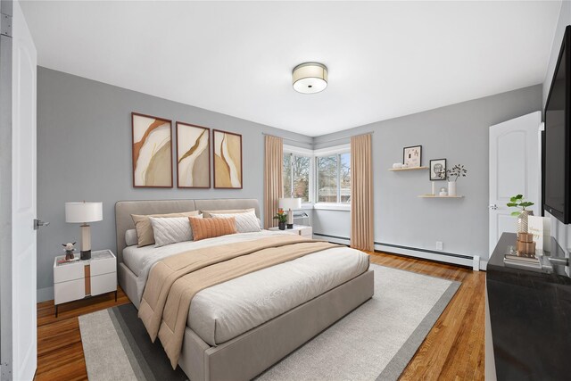 2715 Seymour Ave, Bronx, NY 10469 - bedroom featuring wood finished floors and a baseboard radiator