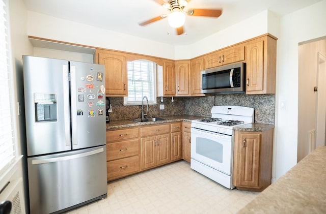 84 Scherer Blvd, Franklin Square, NY 11010 - kitchen featuring stainless steel appliances, light floors, backsplash, and a ceiling fan