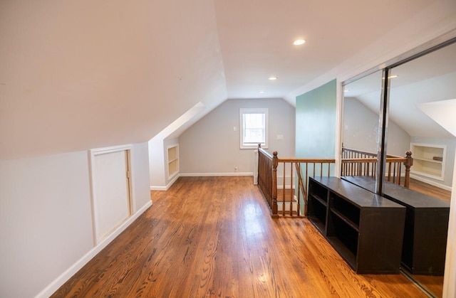 84 Scherer Blvd, Franklin Square, NY 11010 - additional living space with lofted ceiling, wood finished floors, recessed lighting, and built in shelves