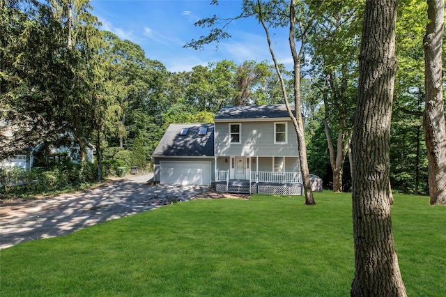 212 Sheldrake Ave, Port Jefferson, NY 11777 - view of front facade featuring a porch, driveway, a garage, and a front lawn