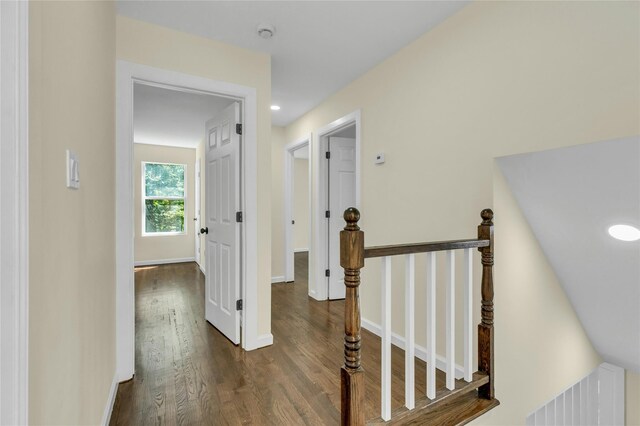 212 Sheldrake Ave, Port Jefferson, NY 11777 - corridor featuring dark wood-style flooring and an upstairs landing