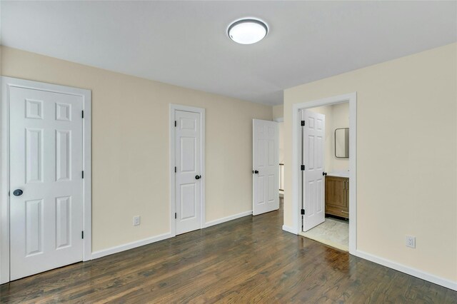 212 Sheldrake Ave, Port Jefferson, NY 11777 - unfurnished bedroom with wood finished floors and ensuite bathroom